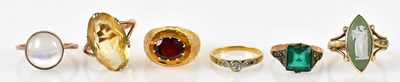 Lot 258 - A group of six yellow metal and gold rings,...