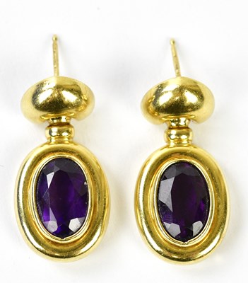 Lot 666 - A pair of 18ct yellow gold and amethyst drop...