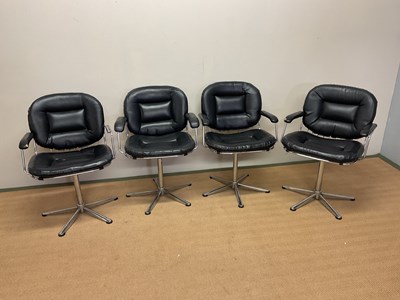 Lot 657 - Four chrome and black swivel chairs, height...