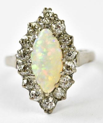 Lot 122 - An 18ct white gold opal and diamond boat...