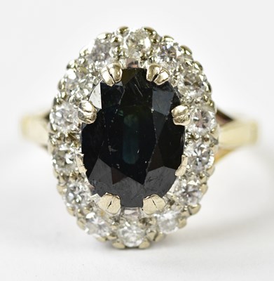 Lot 123 - An 18ct yellow gold sapphire and diamond oval...