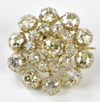 Lot 571 - A white metal diamond set combination...