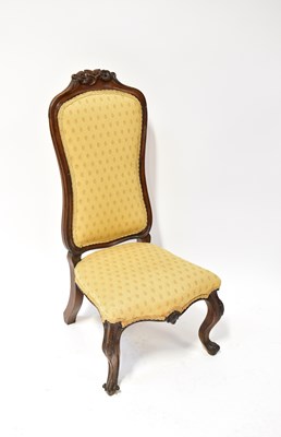 Lot 39 - A Victorian walnut nursing chair with floral...