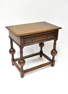 Lot 24 - A reproduction side table of Jacobean style,...