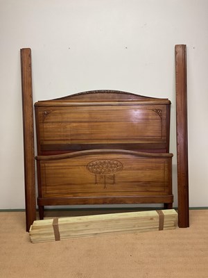 Lot 675 - An Edwardian double bed with carved detail to...