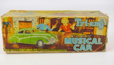 Lot 207 - TRI-ANG; a 'No.2 Minic Musical Car', blue,...