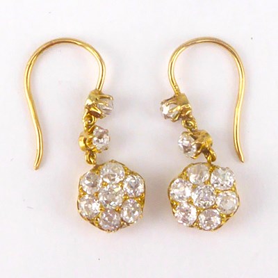 Lot 1114 - A pair of gold diamond cluster drop earrings,...