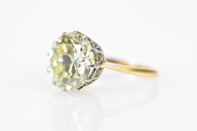 Lot 23 - An 18ct yellow gold diamond solitaire ring,...