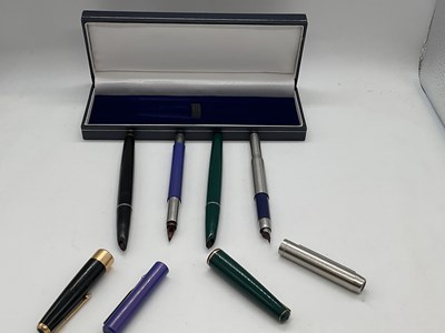 Lot 48 - Four Parker pens (af)