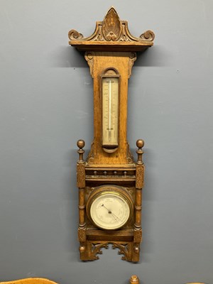 Lot 6378 - A late 19th century carved oak aneroid...