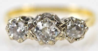 Lot 142 - A yellow metal illusion set diamond three...