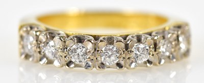 Lot 144 - An 18ct yellow gold illusion set diamond seven...