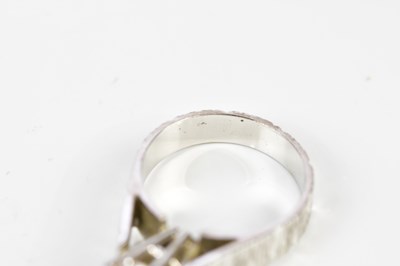 Lot 48 - A white metal diamond solitaire ring, the claw...