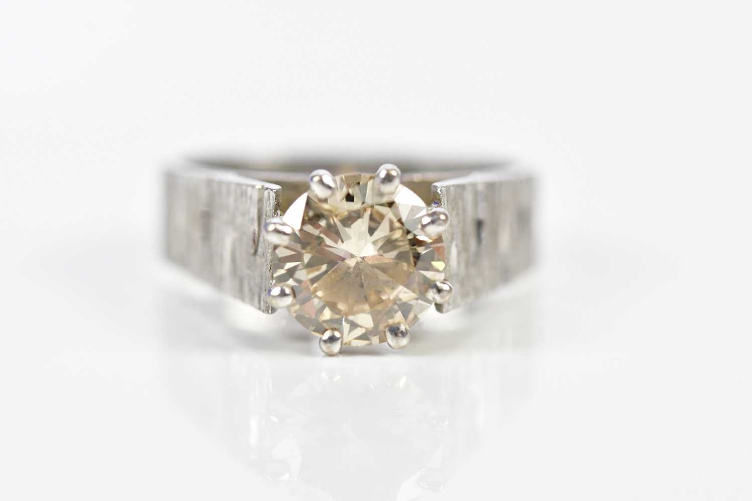 Lot 48 - A white metal diamond solitaire ring, the claw...