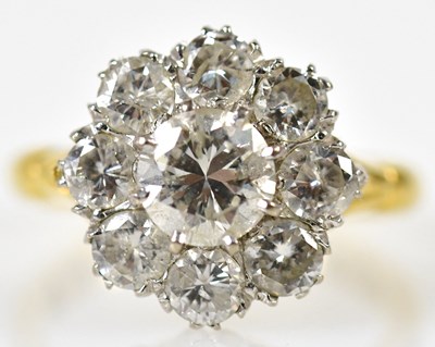 Lot 70 - An 18ct yellow gold and diamond flower head...