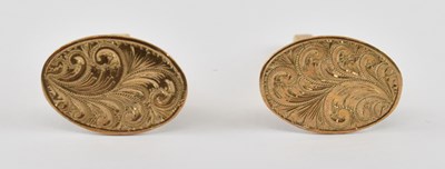 Lot 949 - A pair of 9ct yellow gold cufflinks, combined...