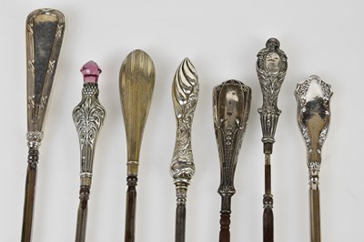 Lot 2491 - Six hallmarked silver handled button hooks and...