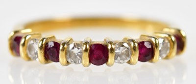 Lot 147 - An 18ct yellow gold ruby and diamond nine...