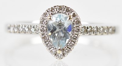 Lot 221 - An 18ct white gold diamond and pale aquamarine...