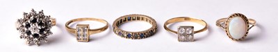 Lot 150 - Five yellow metal and gold rings, two set with...