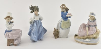 Lot 538 - NAO; a group of four porcelain figures of...