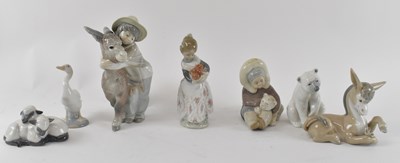 Lot 539 - LLADRÓ; a group of six figures including boy...