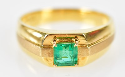 Lot 119 - A yellow metal and emerald gentleman’s ring...