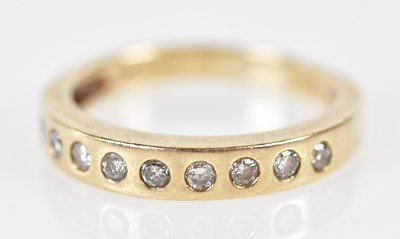 Lot 188 - A 9ct yellow gold half eternity ring, size S,...