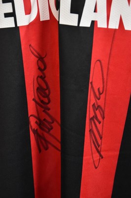 Lot 5275 - AC MILAN; a retro-style football shirt, signed...