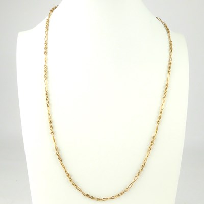 Lot 1098 - A 9ct rose gold chain and twist link necklace...