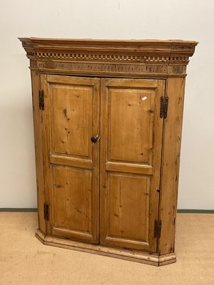 Lot 602 - A 19th Century pine corner cupboard, height...