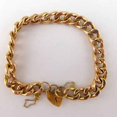 Lot 1067 - A 9ct gold hollow curb link bracelet, with 9ct...