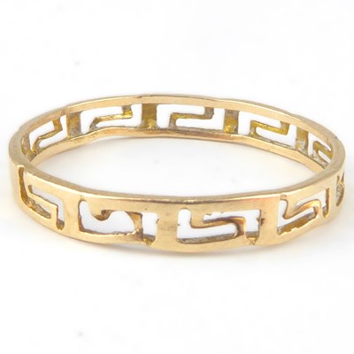 Lot 1035 - A 14ct gold band ring with open Greek key...