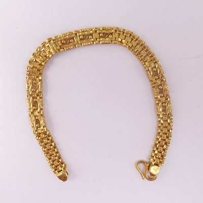 Lot 1072 - A bright cut Thai gold reticulated bracelet...