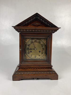Lot 6413 - An oak cased 20th century mantel clock, with...