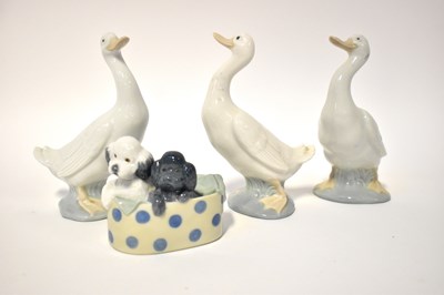 Lot 613 - NAO; three figures of geese and another figure...