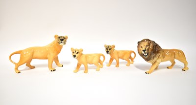 Lot 550 - BESWICK; a family of lions comprising male,...