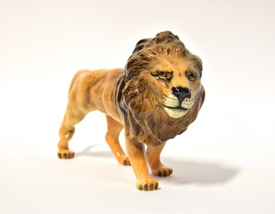 Lot 553 - BESWICK; a figure of a standing male lion.