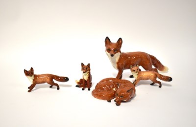 Lot 561 - BESWICK; five figures of foxes, comprising...