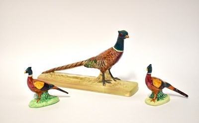 Lot 558 - BESWICK; a model of a pheasant on rectangular...