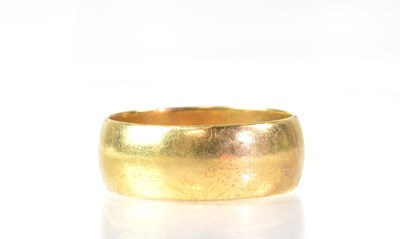 Lot 1018 - A 9ct yellow gold broad wedding band, size Y,...