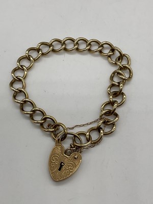 Lot 394 - A 9ct yellow gold curb link bracelet with...