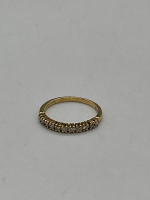 Lot 390 - An 18ct yellow gold and diamond set half...