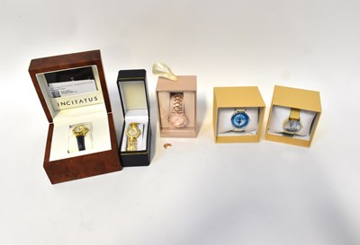 Lot 1181 - Five boxed fashion watches, including two...