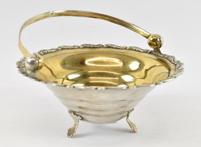 Lot 790 - A Russian silver circular bowl with swing...