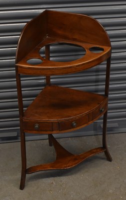 Lot 64 - A Georgian mahogany corner wash stand with...