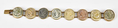 Lot 557 - A carved lava cameo bracelet set with eight...