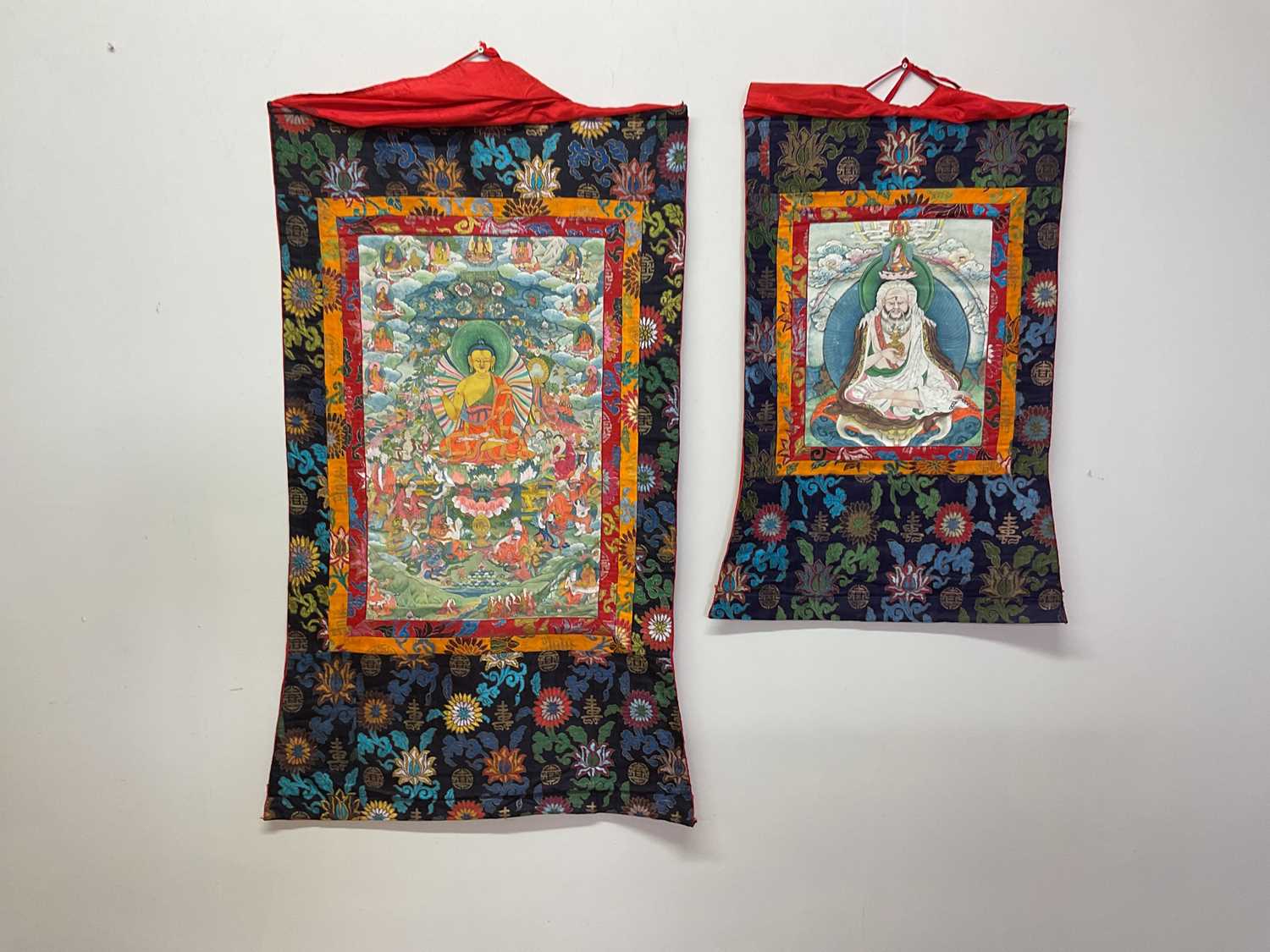 Lot 103 - Two Thangkas, Tibetan silk brocade with...