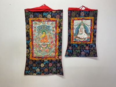 Lot 103 - Two Thangkas, Tibetan silk brocade with...