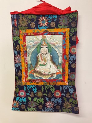 Lot 103 - Two Thangkas, Tibetan silk brocade with...